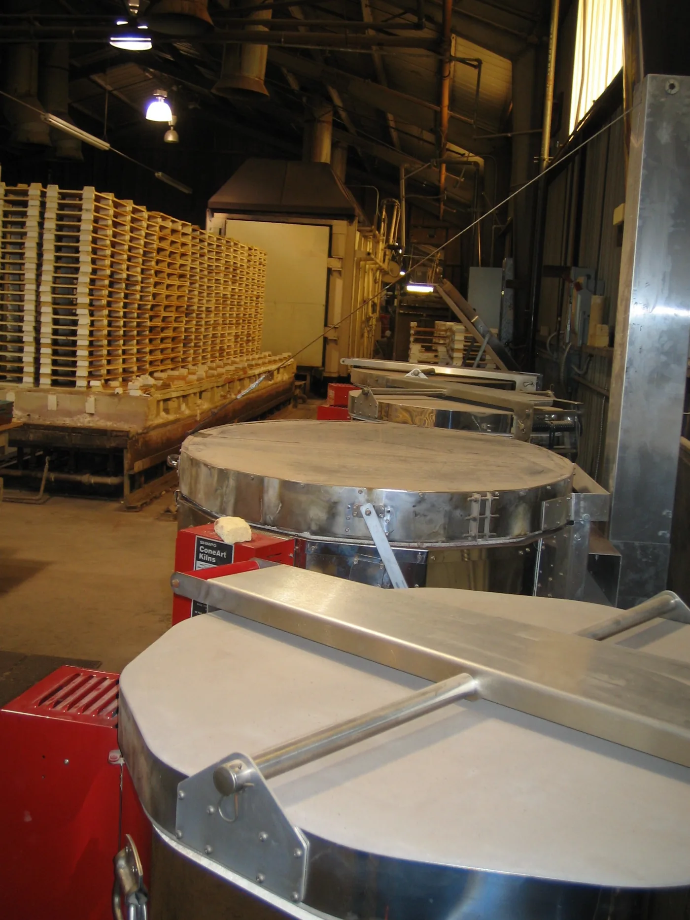 Ceramic tile production facility with kilns and material preparation equipment